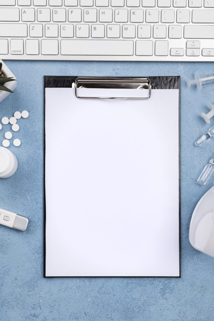 arrangement-medical-desk-with-empty-clipboard
